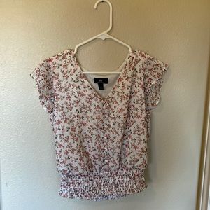 pink floral blouse with flutter sleeves